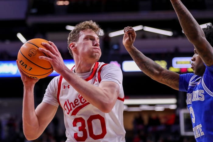Jan 22, 2023; Cincinnati, Ohio, USA; Cincinnati Bearcats forward Viktor Lakhin (30) drives to the basket against Memphis Tigers guard Kendric Davis (3) in the first half at Fifth Third Arena. Mandatory Credit: Katie Stratman-USA TODAY Sports